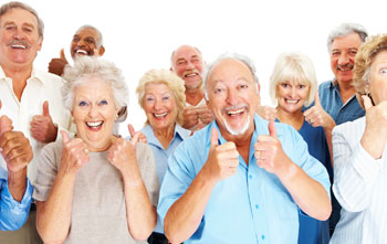 Group of seniors showing their thumbs up for Onelife Care